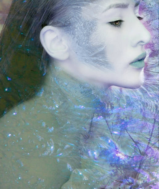 The beautiful elegant fashion model in blue or turquoise tones with tiara is on blue or turquoise background. Fashion portrait.