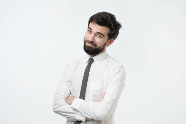 istock Smiling handsome hispanic man in white shirt crossing hands. 1079081212