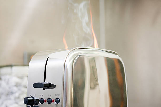 Toaster on fire  toaster appliance stock pictures, royalty-free photos & images