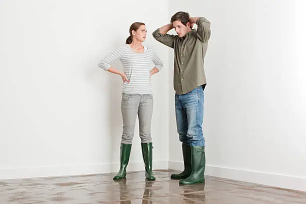Photo of Young couple on flooded floor