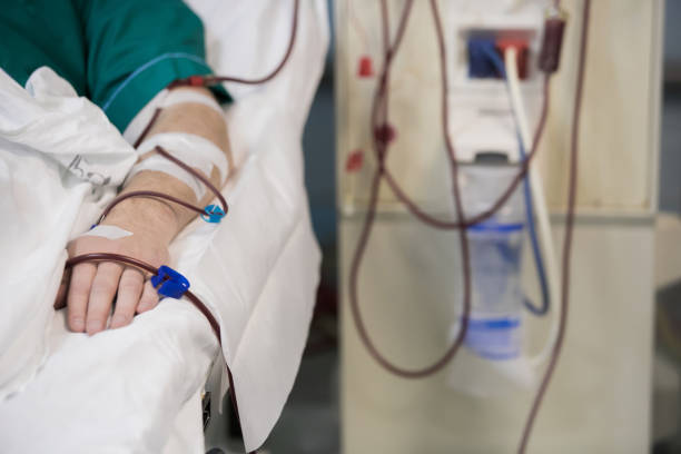 Patient getting blood transfusion in hospital clinic stock photo