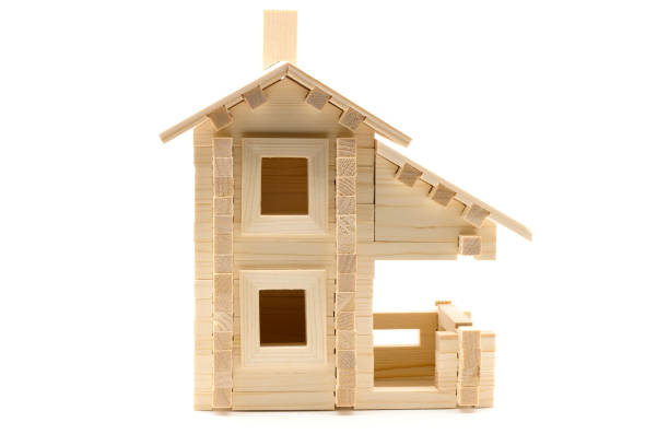 istock Wooden toy house isolated on white 1079090056