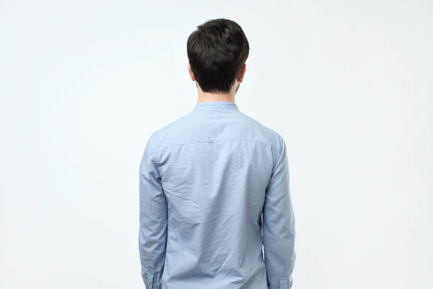 istock Young man in blue shirt standing alone 1079091842