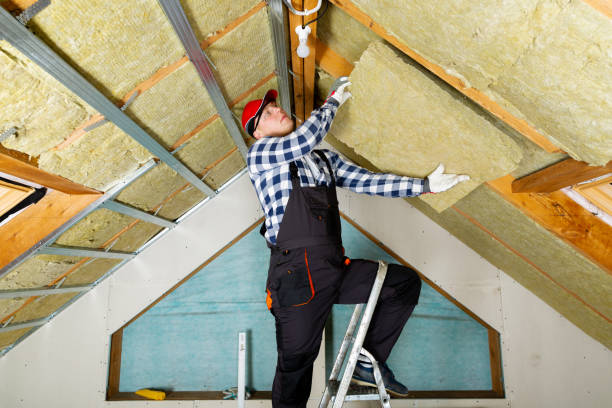 istock Man installing thermal roof insulation layer - using mineral wool panels. Attic renovation and insulation concept 1079092202
