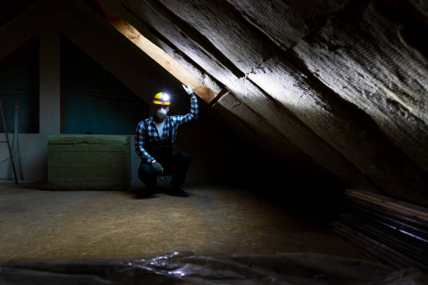 istock Man installing thermal roof insulation layer - using mineral wool panels. Attic renovation and insulation concept 1079093360