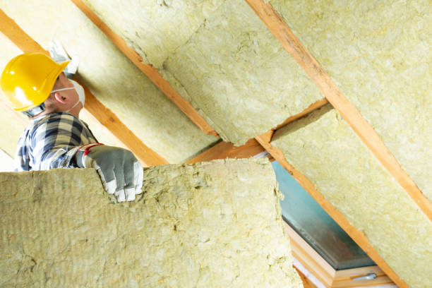 istock Man installing thermal roof insulation layer - using mineral wool panels. Attic renovation and insulation concept 1079093642