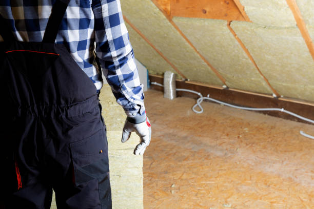 istock Man installing thermal roof insulation layer - using mineral wool panels. Attic renovation and insulation concept 1079093826