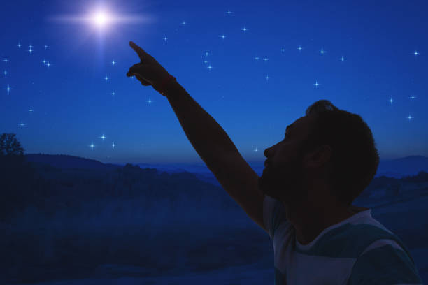 istock Man pointing at the starry night sky. Elements of this image are my work. 1079096070