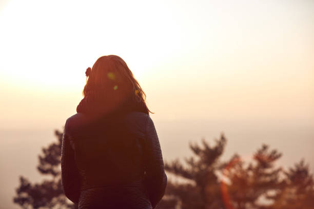 istock Lonely woman watching distant nature landscape. 1079096802