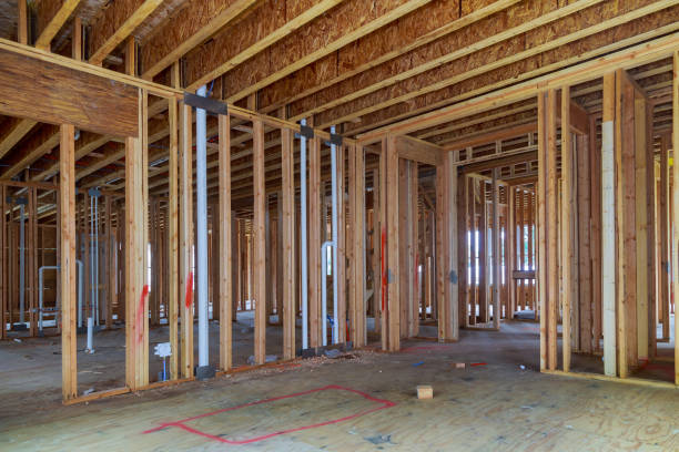 istock Wood frame of house under beam construction 1079098314