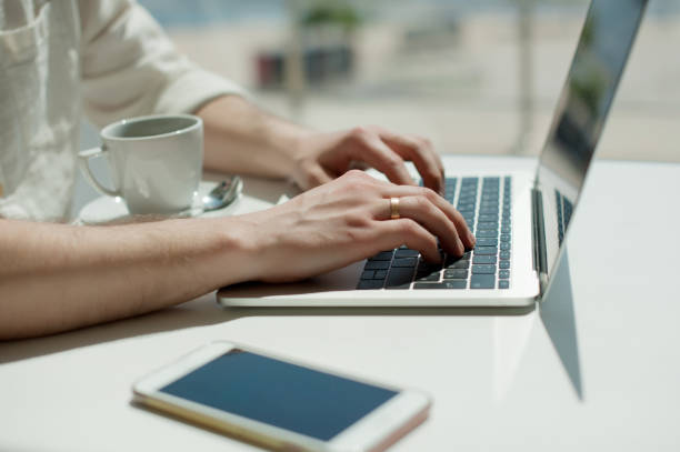 istock Businessman working laptop for new architectural project. Generic design notebook on the table. Young businessman working with laptop at office. Unrecognizable man using a modern portable computer 1079101240