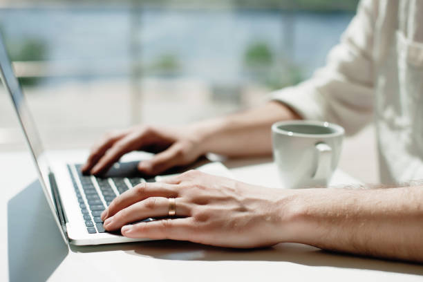 istock Businessman working laptop for new architectural project. Generic design notebook on the table. Young businessman working with laptop at office. Unrecognizable man using a modern portable computer 1079101308