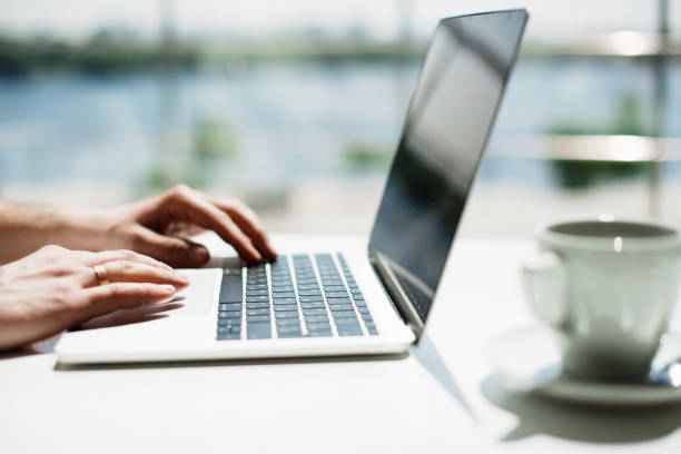 istock Businessman working laptop for new architectural project. Generic design notebook on the table. Young businessman working with laptop at office. Unrecognizable man using a modern portable computer 1079101416