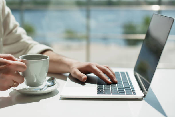 istock Businessman working laptop for new architectural project. Generic design notebook on the table. Young businessman working with laptop at office. Unrecognizable man using a modern portable computer 1079101440