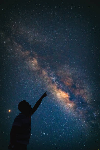 istock Man pointing at the starry night sky. Elements of this image are my work. 1079103580