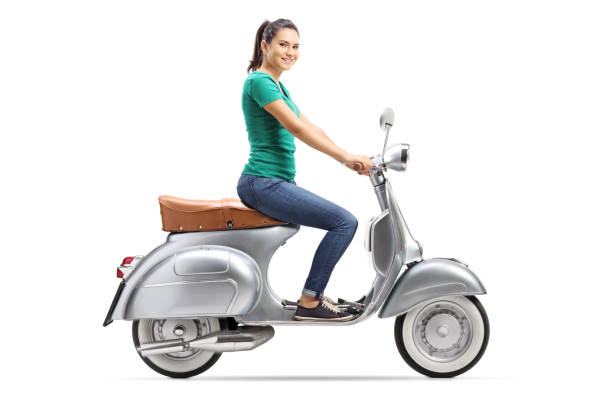 istock Young female riding a vintage scooter 1079107630