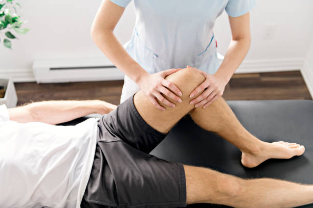 istock Patient at the physiotherapy doing physical exercises with his therapist 1079107906