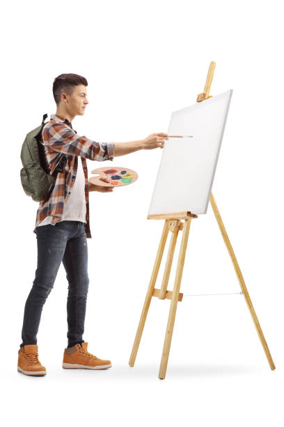 istock Teen student painting on a canvas 1079108228
