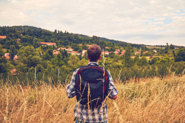 Hiker enjoying nice view in a hilly landscape.