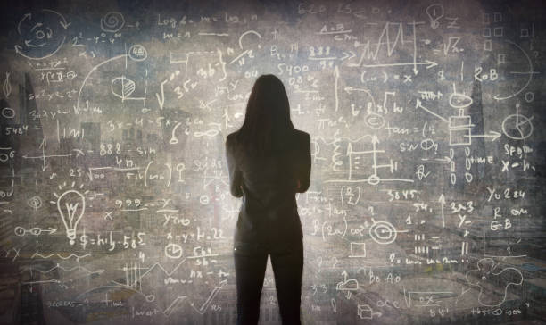 istock Young woman looking on the black board with mathematical formulas and calculations. Bright idea, way of thinking, discovery and challenge concept. 1079126412