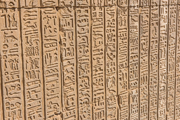 istock Hieroglyphic carvings on an ancient egyptian temple wall 1079130608