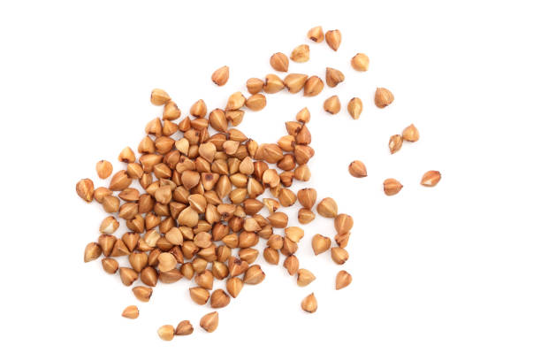 istock buckwheat grain isolated on white background close up. Top view 1079142890