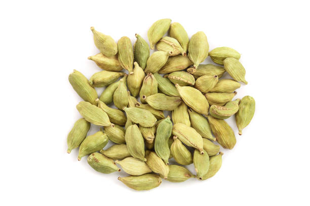 istock Green cardamom seeds isolated on white background. Top view. Flat lay 1079145212