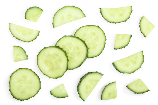 istock Cucumber slices isolated on white background. Top view. Flat lay pattern 1079146548
