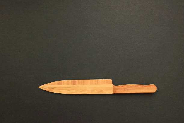 istock Wooden knife on blackboard 1079153708