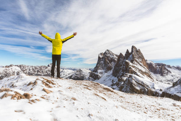 istock Successful man on top of snowy mountain 1079154578