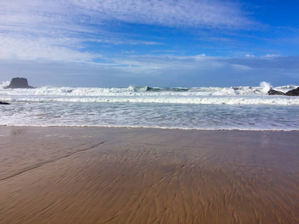 istock sea waves and rocks, sea surf 1079159574