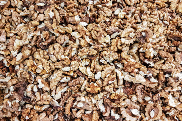 istock Background of shelled dried walnuts in close-up (high details) 1079166238