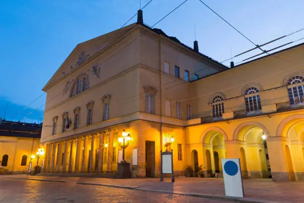 Parma - The street of the old town at dusk and the Teatro Regio theater.