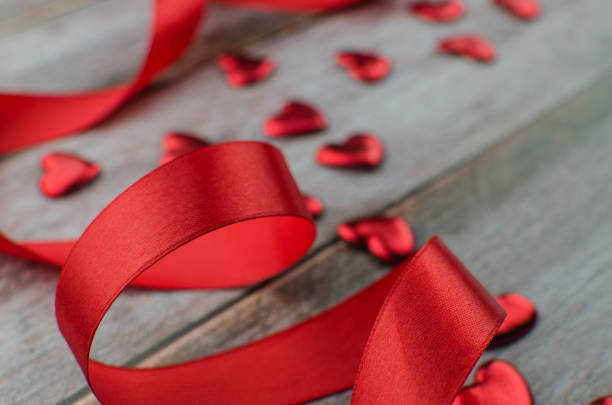 istock Ribbons shaped as hearts on white, valentines day concept 1079178956
