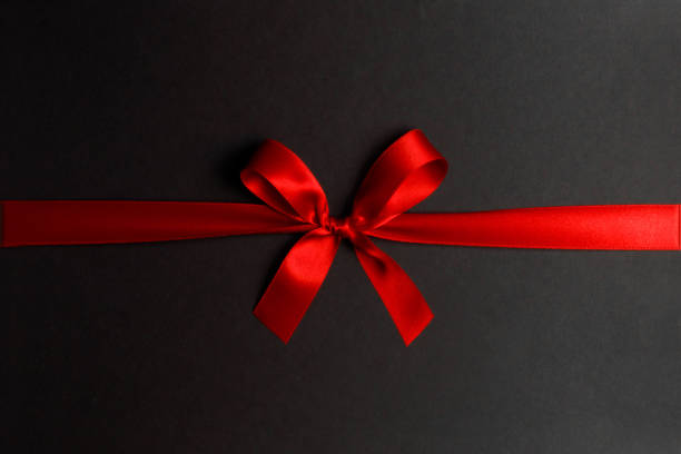 istock Shiny red satin ribbon bow 1079205656