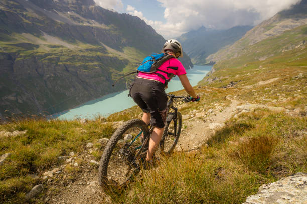 summer mountain biking adventure - france european alps landscape meadow imagens e fotografias de stock