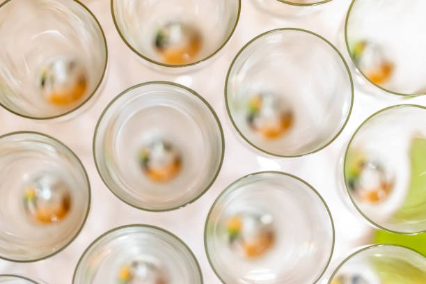 Abstract alcohol art: top view of wine glasses in rows, ready for a degustation stock photo