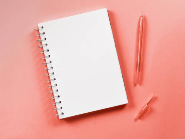 istock Top view of blank note on living coral background 1079219938