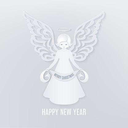 Christmas cute angel with scroll in the hands with Merry Christmas text on a light background. Ornamental wings in paper cut style. Happy new year card in the style of layered paper.