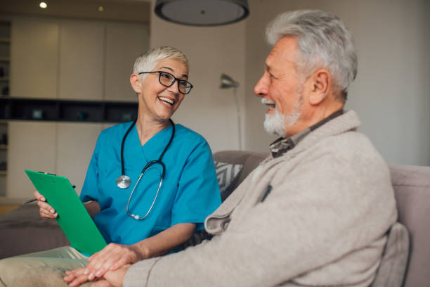 istock Smiling patient looking at happy nurse 1079257372