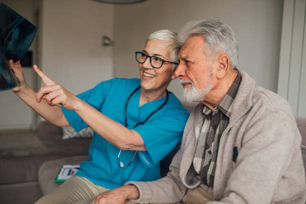 istock Patient and a nurse looking at x ray image 1079257388