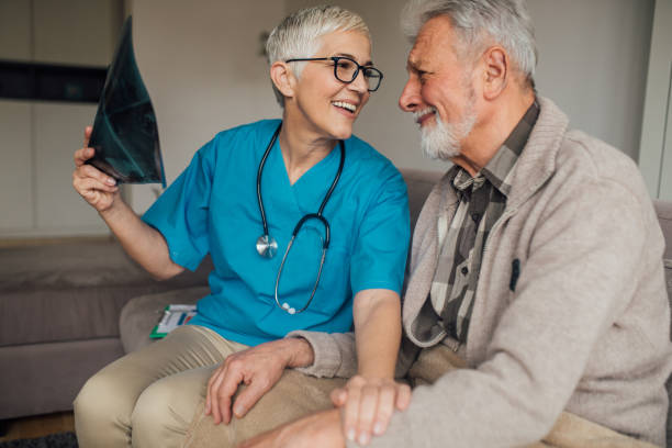 istock Smiling couple looking at x ray image 1079257440