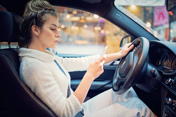 young girl is texting in the traffic jam in a rainy day - traffic jam traffic sports utility vehicle car imagens e fotografias de stock