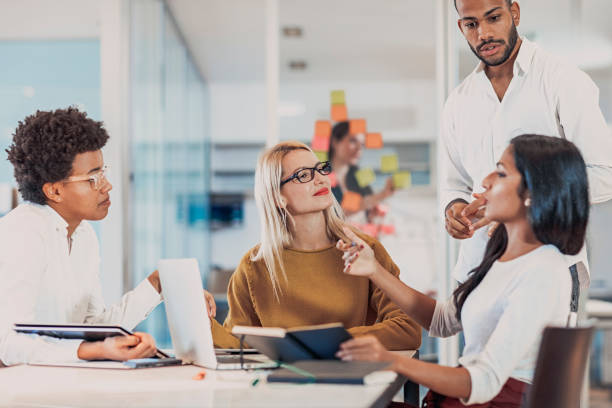istock Multi ethnic business coworkers discussing during meeting  at office 1079278694