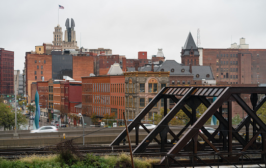 View over the train tracks and highway to the buildings of main street in downtown Rochester New York