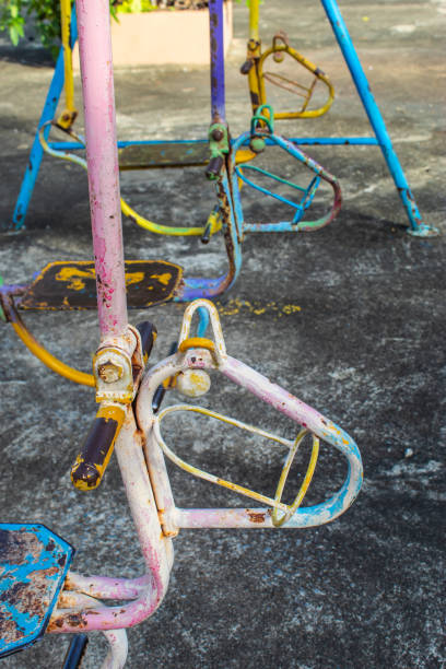 istock Swing chairs for children in park. 1079326486