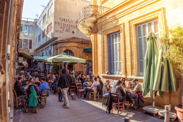 NICOSIA - APRIL 13, 2015: Street cafe in Phaneromeni Square, old quarter of Nicosia NICOSIA - APRIL 13, 2015: Street cafe in Phaneromeni Square, old quarter of Nicosia nicosia cyprus stock pictures, royalty-free photos & images