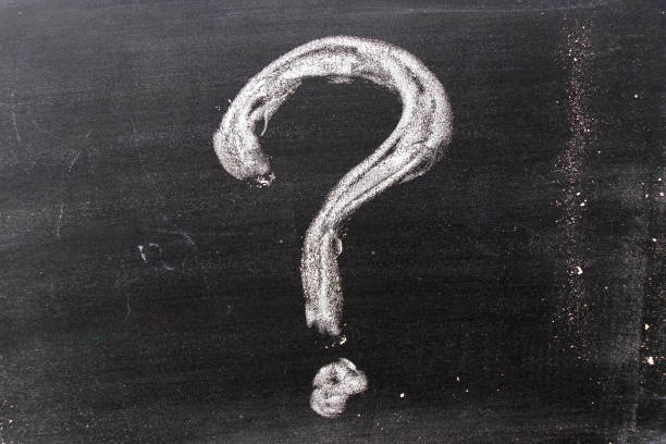 istock White color chak hand drawing in question mark shape on blackboard background 1079348448
