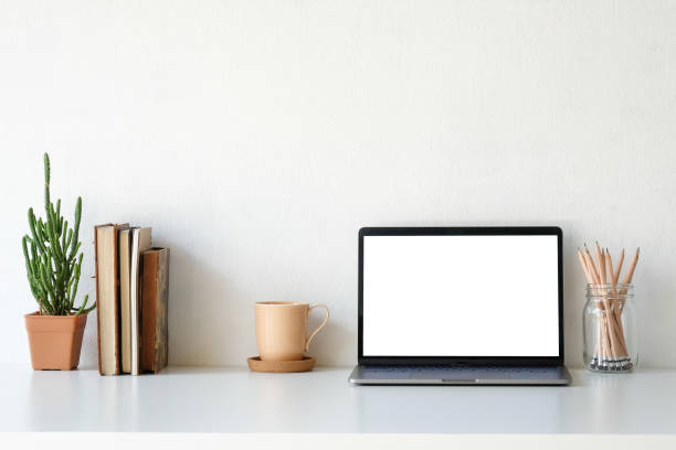 istock Workplace mockup concept. Mock up home decoration laptop and office supply with copy space for products display montage. 1079401628