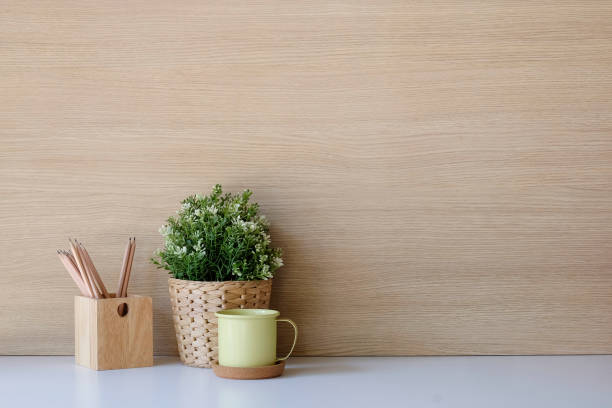 istock Copy space Mockup workspace with coffee, pencil and plant on desk and wood wall. 1079401832